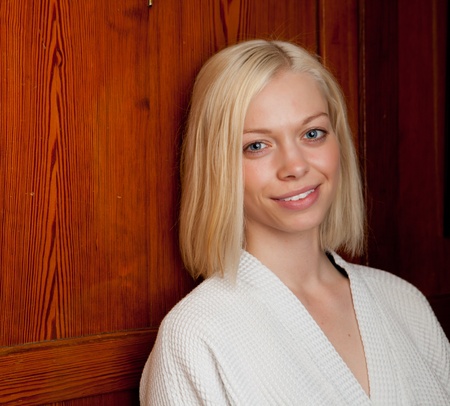 Portrait of a woman in an old wooden spa interiorの写真素材