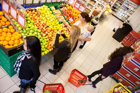High angle view of busy people shopping in supermarketの写真素材