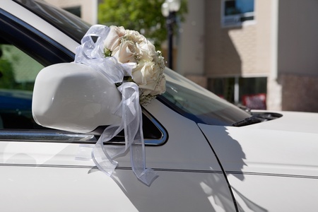 Flower bouquet on car bonnetの写真素材