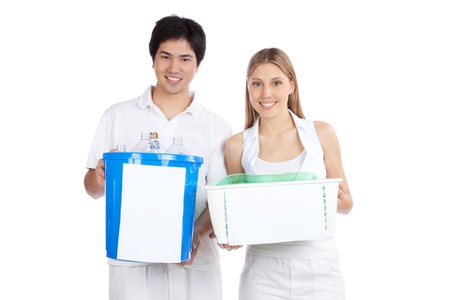 Portrait of young happy couple holding recycle bin  の写真素材
