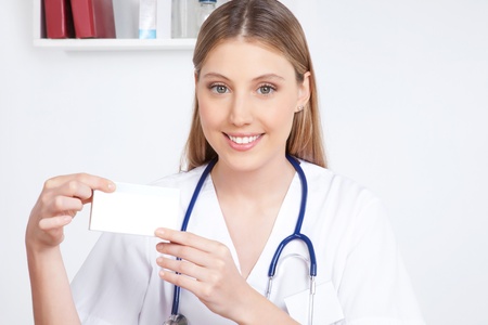 Happy smiling female doctor  holding a medicine packet の写真素材