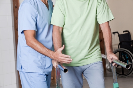 Senior man having ambulatory therapy with his therapist Senior man having ambulatory therapy with his therapist