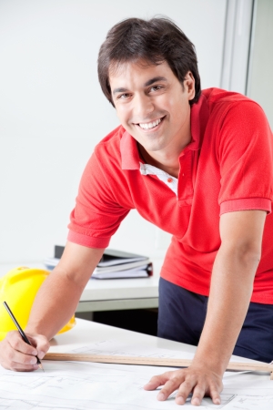 Architect working on blueprints and construction plans  の写真素材