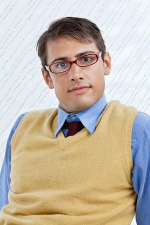 Portrait of smart young male business executive wearing eyeglasses over textured backgroundの写真素材