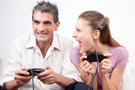 Excited couple playing computer games  