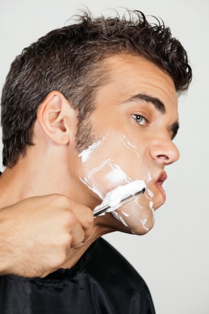 Mature Man Shaving His Faceの写真素材