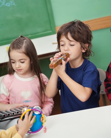 Children Playing Musical Instruments In Classroomの写真素材