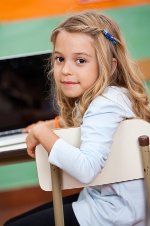 Girl With Laptop In Classroomの写真素材