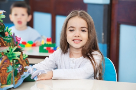 Little Girl With Popup Book In Preschoolの写真素材