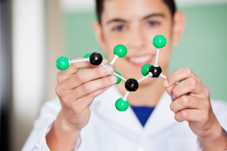 Schoolboy Examining Molecular Structure In Labの写真素材
