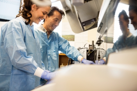 Lab technicians trouble shooting chemistry analyzer