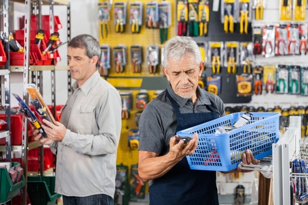 Senior Salesman Working In Hardware Storeの写真素材