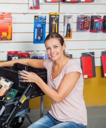 Woman Buying Tools In Hardware Storeの写真素材