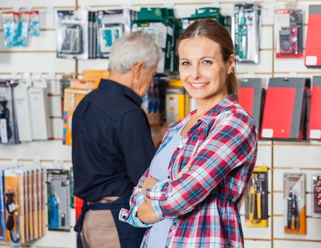 Customer With Hands Folded In Hardware Storeの写真素材
