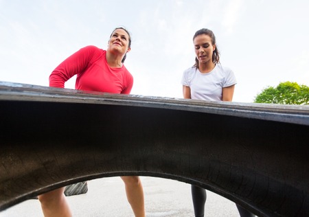 Fit Women Lifting Tire Outdoorsの写真素材