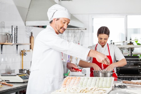 Chefs Preparing Ravioli Pastaの写真素材