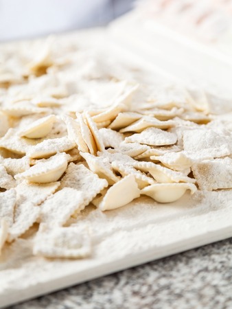 Flour Sprinkled On Raw Ravioli Pastaの写真素材