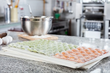 Ravioli Pasta On Cutting Board At Countertop In Commercial Kitchの写真素材