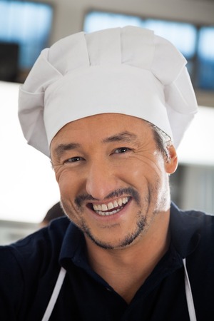 Closeup Portrait Of Cheerful Male Chefの写真素材