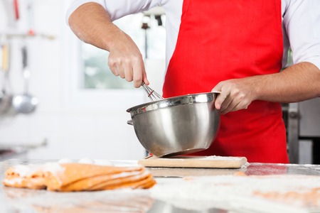 Chef Mixing Batter To Prepare Ravioli Pasta In Kitchenの写真素材