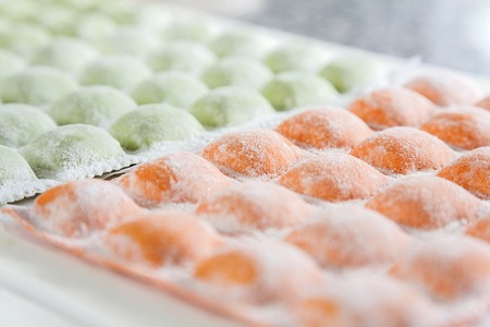 Closeup Of Raw Ravioli Pasta On Cutting Boardの写真素材