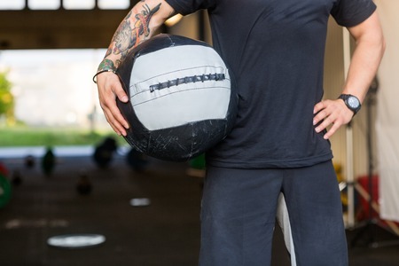 Fit Man Carrying Medicine Ballの写真素材