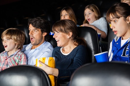 Amazed Families Watching Movieの写真素材