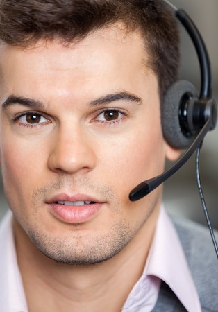 Call Center Employee Wearing Headset In Officeの写真素材