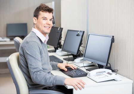 Customer Service Representative Working In Officeの写真素材