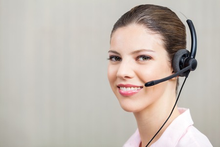 Female Employee Wearing Headset At Call Centerの写真素材