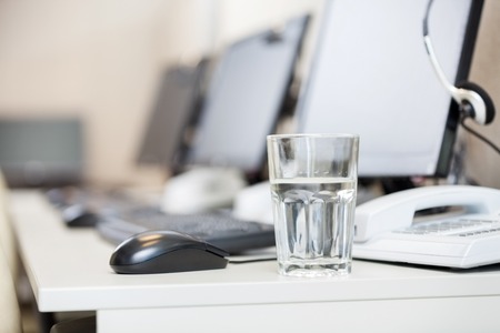 Water Glass On Desk At Call Centerの写真素材