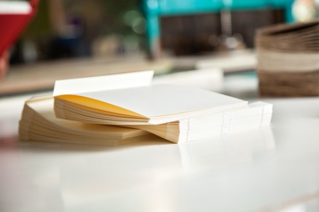 Closeup of notebooks on table in factoryの写真素材