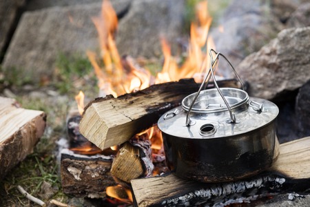 Closeup Of Metallic Pot On Bonfireの写真素材