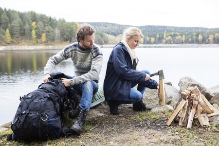 Couple Preparing For Camping On Lakeshoreの写真素材
