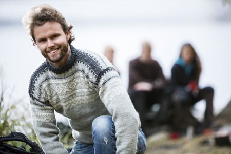 Portrait Of Happy Young Man At Campsiteの写真素材