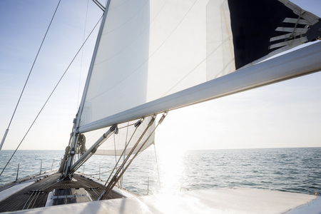 Yacht Sailing In Sea On Sunny Dayの写真素材