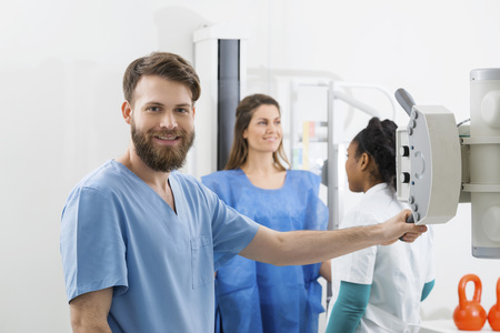 Radiologists Preparing For X-ray Over Female Patient In Hospitalの写真素材