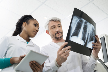 Radiologists With X-ray Using Digital Tablet In Hospitalの写真素材