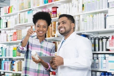 Patient Pointing Away While Standing By Chemistの写真素材