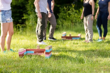 Building Blocks By Male And Female Friends On Fieldの写真素材