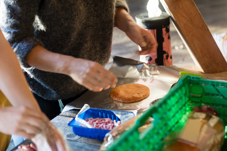 Woman With Bread Preparing Meal In Shedの写真素材