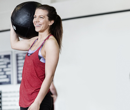 Woman With Medicine Ball On Shoulderの写真素材