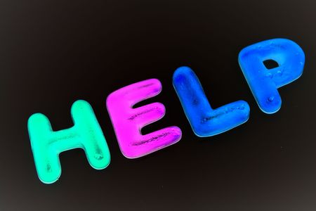 illuminous  help over a black backgroundの写真素材