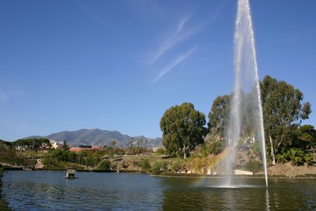 large fountain in a lake in a parkの写真素材