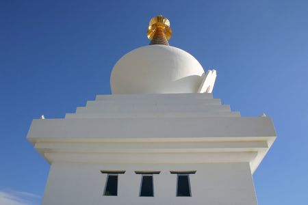 dome of a mosque set against a blue skyの写真素材