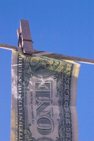 laundered money against a blue backgroundの写真素材