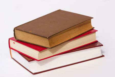 pile of three books over a white backgroundの写真素材