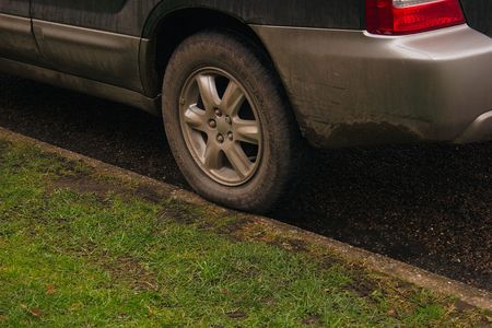 car illegally parked on the kerbの写真素材