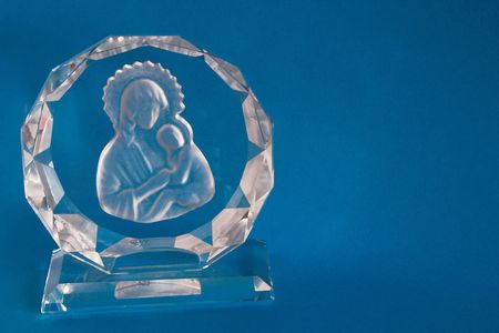 Mary and Jesus in glass against a blue backgroundの写真素材