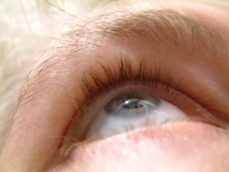 closeup of an eye looking upwardsの写真素材